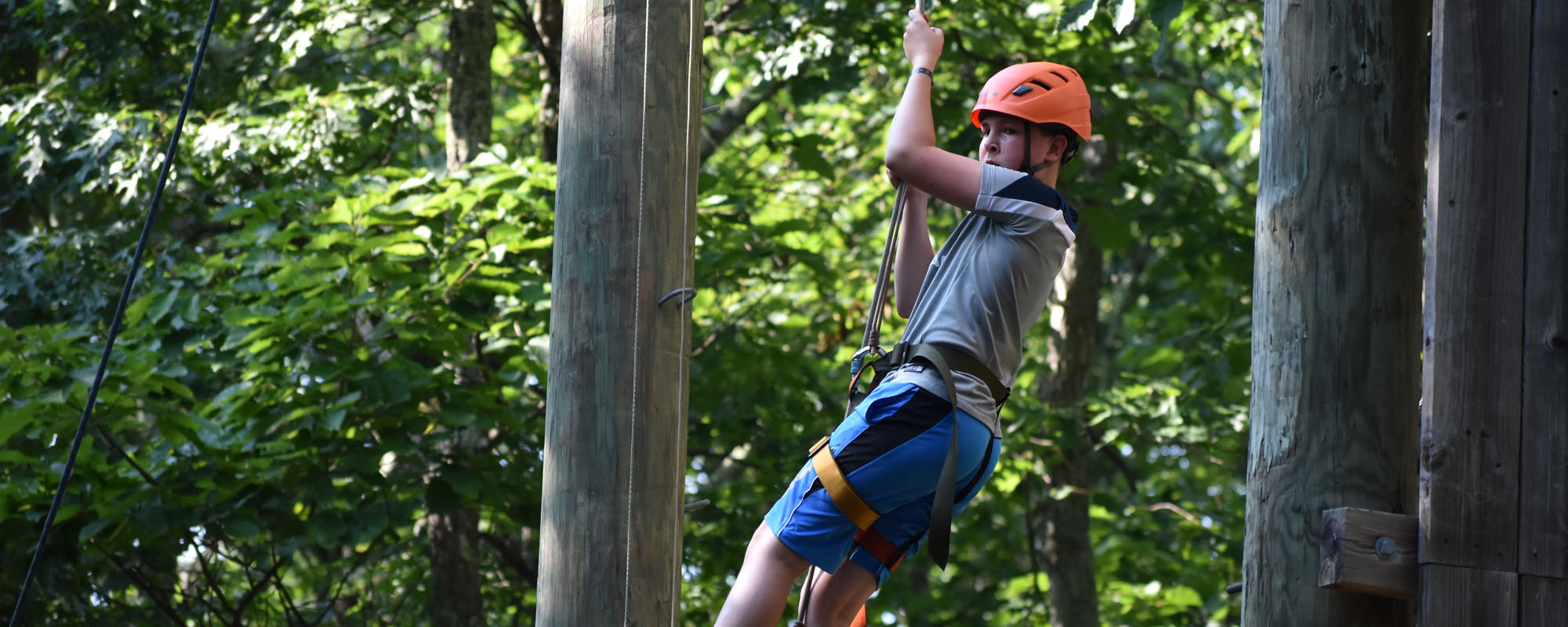 Camper on the ropes course