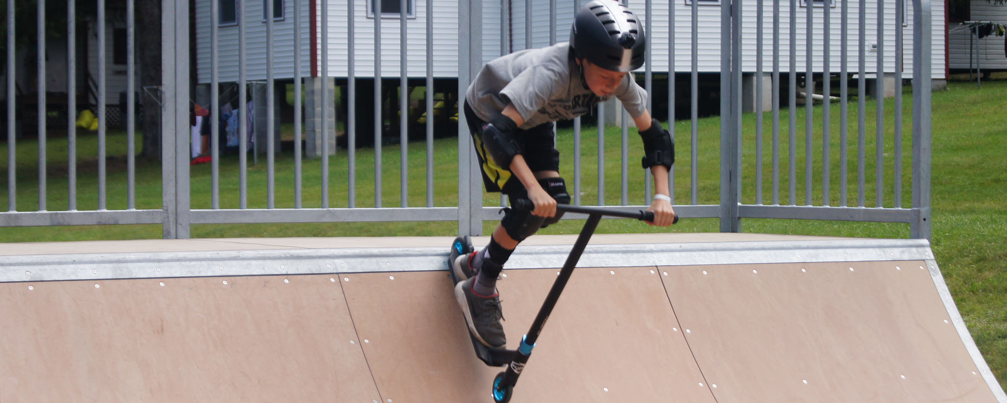 Scooter rider on halfpipe