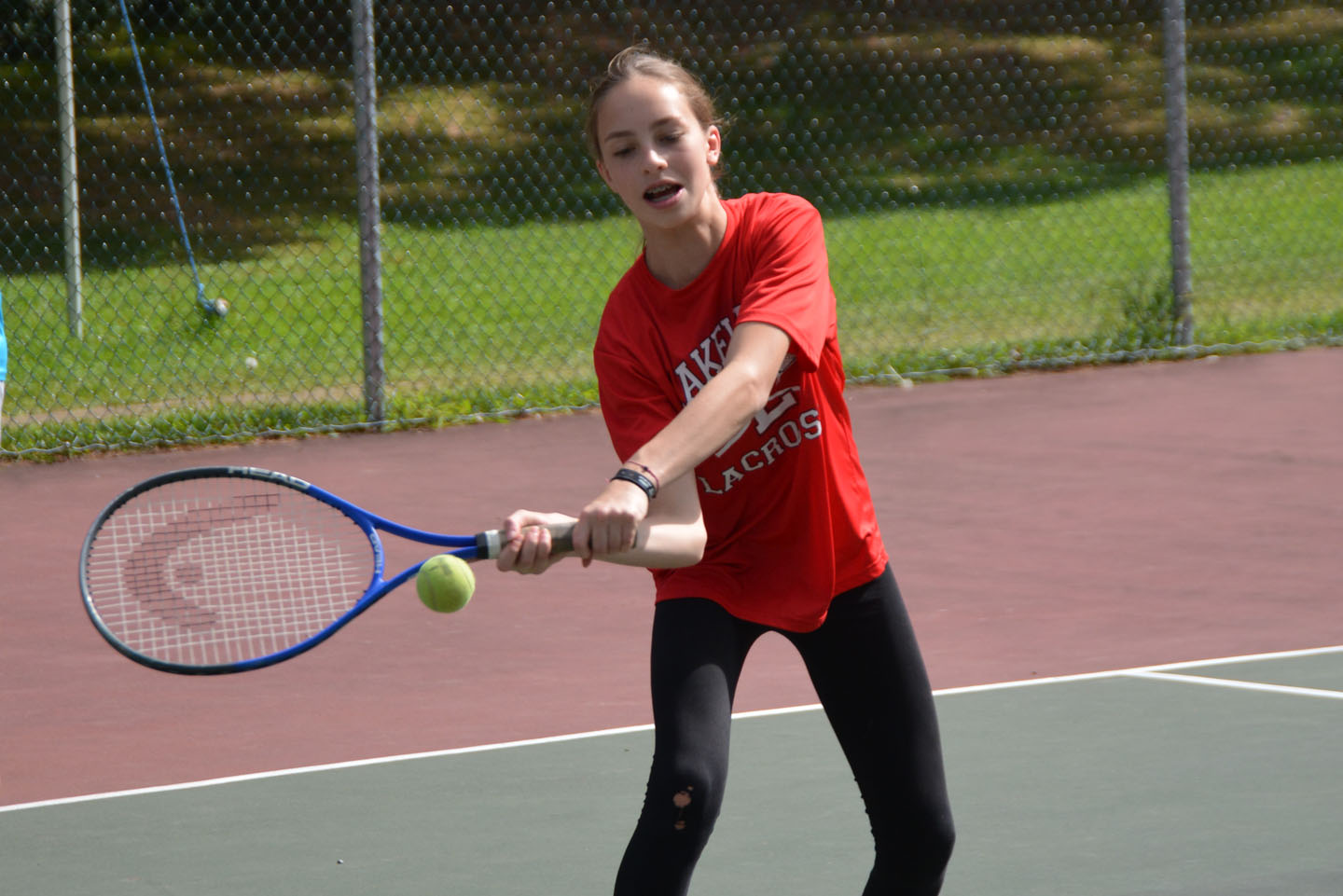 Camper practicing forehand