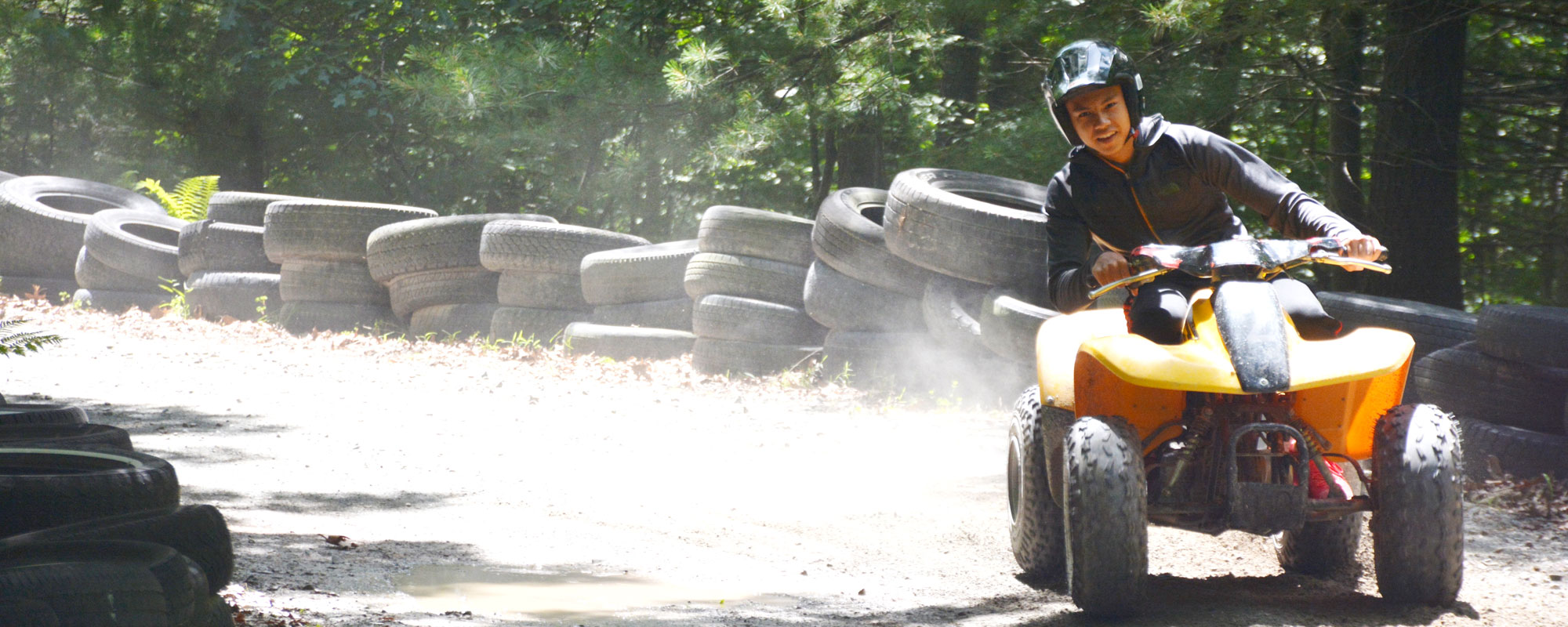 Kids riding ATVs at Lake Greeley Camp